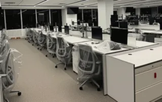 Office workspace with wrapped chairs prepared for business relocation