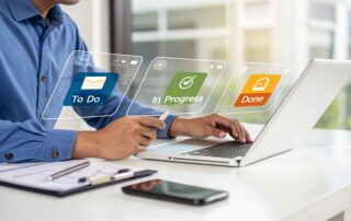 Man using a laptop and stylus interacts with a futuristic holographic interface displaying project management stages to do in progress done