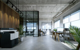 Modern office interior with exposed concrete ceiling and floor.